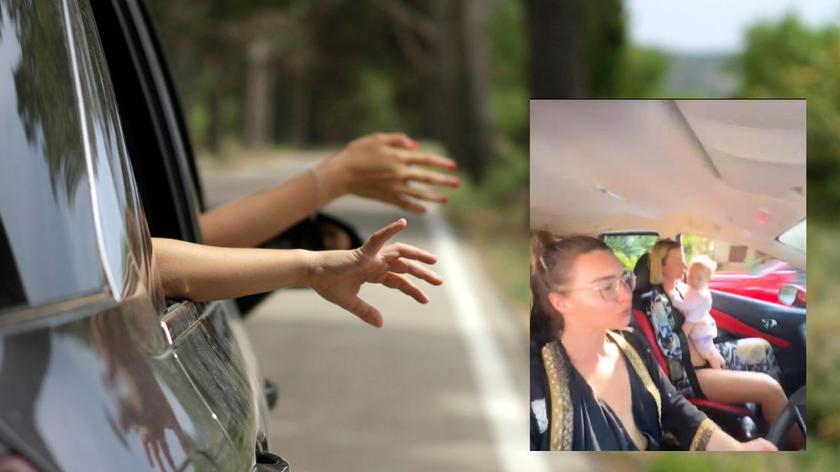 Ręce wystawione przez okno samochodu