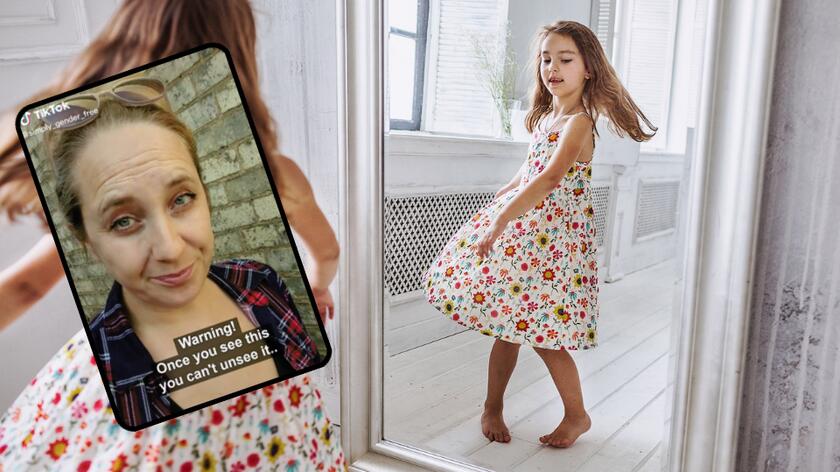 Dziewczynka w sukience przegląda się w lustrze